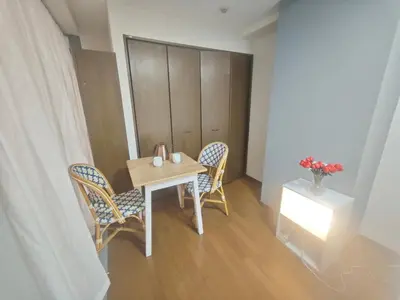 a small table and two chairs in a room at ZYZHigashinippori 1DK AK0255 in Tokyo