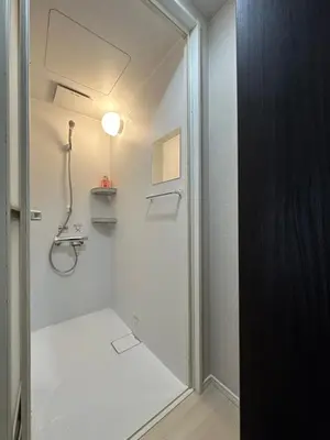 a bathroom with a shower and a glass door at \u798f\u30db\u30c6\u30eb501 in Tokyo
