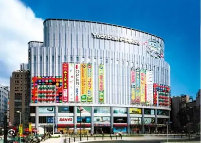 a large building with colorful signs on the side of it at \u6d45\u8349\u6a4b202 in Tokyo