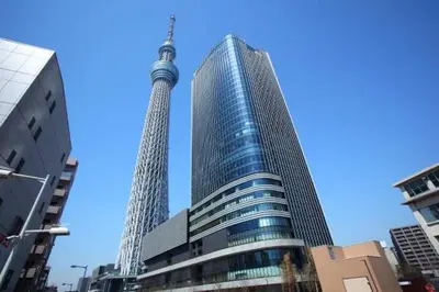 a view of two tall buildings in a city at \u6d45\u8349\u6a4b202 in Tokyo