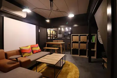 a living room with a couch and a table at \u30a2\u30f3\u30c9\u30b9\u30c6\u30a4\u5343\u4f4f\u5bff\u753a in Tokyo