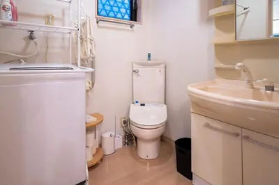 a small bathroom with a toilet and a sink at Y's INN 北砂 101T in Tokyo