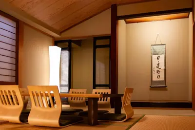 a room with chairs and a table and a sign at Sky Tree View Asakusa in Tokyo