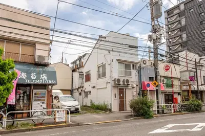 a street in an asian city with buildings at Bibarudy Shinagawa -\u54c1\u5ddd\u30a8\u30ea\u30a2\u99c5\u524d1\u52068\u540d \u7fbd\u7530\u7a7a\u6e2f25\u5206- in Tokyo