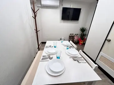 a white table with plates and silverware on it at Y-Shinjuku City, Okubo 5F-SJ0070 in Tokyo