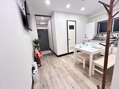 a kitchen and dining room with a white table and chairs at Y-Shinjuku City, Okubo 5F-SJ0070 in Tokyo