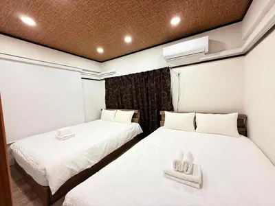 two beds in a room with towels on them at Y-Shinjuku City, Okubo 5F-SJ0070 in Tokyo