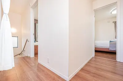 an empty room with a bed and a mirror at kamiikebukuro house 4LDK free wifi free parking in Tokyo