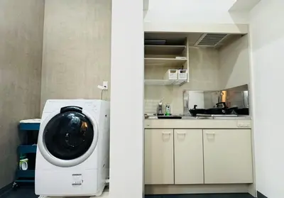 a kitchen and a washing machine in a kitchen at Sugamo hotel 101-TS0333 in Tokyo