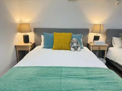 a bedroom with a bed with a teddy bear on it at Sugamo hotel 101-TS0333 in Tokyo