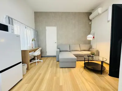 a living room with a couch and a table at Sugamo hotel 101-TS0333 in Tokyo