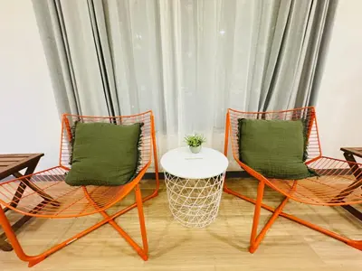 two chairs and a table in front of a curtain at Sugamo hotel 101-TS0333 in Tokyo