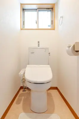 a white toilet in a bathroom with a window at akl\u6771\u745e\u6c5f3\u4e01\u76ee in Tokyo