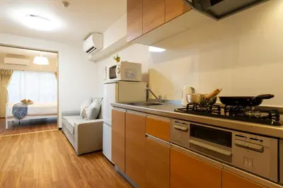 a kitchen with a sink and a stove top oven at N102 NEW OPEN IKEBUKURO FREE WiFi MAX7GUESTS in Tokyo