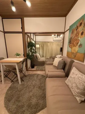 a living room with a couch and a table at Best Shinjuku Modern Full-furnished Family size Apartment5 ONLY 2min to Shinjuku by Train in Tokyo