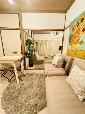 a living room with a couch and a table at Best Shinjuku Modern Full-furnished Family size Apartment5 ONLY 2min to Shinjuku by Train in Tokyo