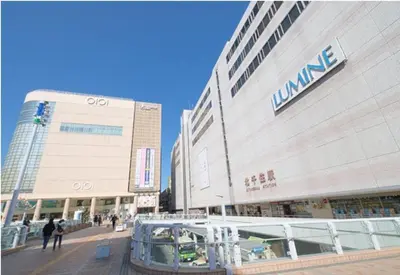 a large building with people walking in front of it at \u5317\u5343\u4f4f\u306e\u4e00\u8ed2\u5bb6\uff4b3 in Tokyo