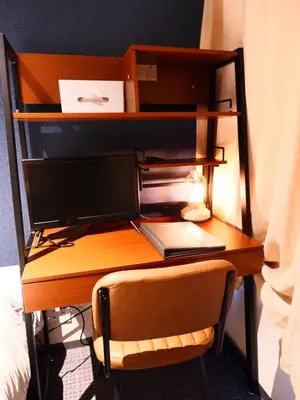a desk with a computer monitor on top of it at ForYou Honancho \u65b9\u5357\u753a in Tokyo