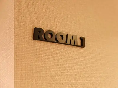 a sign that says room on a wall at ForYou Honancho \u65b9\u5357\u753a in Tokyo