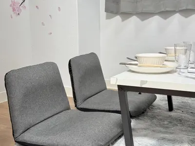 a dining room with two chairs and a table at Shinjuku Waseda home4 in Tokyo