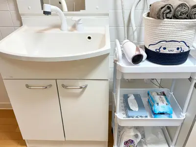 a bathroom with a sink and a shelf under it at Shinjuku Waseda home4 in Tokyo