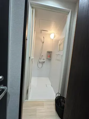 a walk in shower in a bathroom with a white shower stall at \u798f\u30db\u30c6\u30eb401 in Tokyo