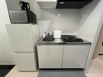 a small kitchen with a stove and a refrigerator at ksf\u4e0a\u6c60\u888b3\u4e01\u76ee101 in Tokyo
