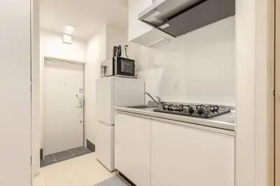 a white kitchen with a stove and a sink at ksf\u4e0a\u6c60\u888b3\u4e01\u76ee101 in Tokyo