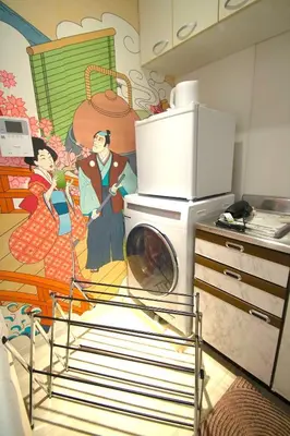 a kitchen with a washing machine in a kitchen at 10min Meguro Sta 18min Shibuya Sta Max2 SAKURA meguro203 in Tokyo