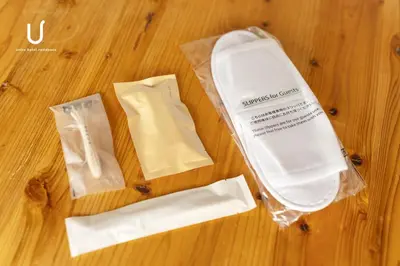 a plastic bag sitting on top of a wooden floor at Hotel Residence Asakusa by unito in Tokyo