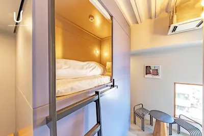 a room with a bed inside of a building at Hotel Residence Asakusa by unito in Tokyo