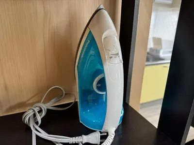 a blue and white iron sitting on a desk at Tokyo Stay Apila in Tokyo