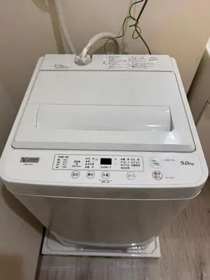 a close up of a washing machine in a bathroom at Tokyo Stay Apila in Tokyo