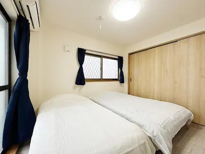 a bedroom with a bed and a window at Tokyo Stay Apila in Tokyo