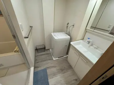 a small bathroom with a toilet and a sink at Tokyo Stay Apila in Tokyo