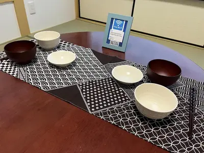 a table with bowls on a black and white table cloth at 1\uff0d54\uff0d8 - Vacation STAY 61773v in Tokyo