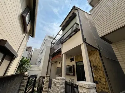 a house with a black gate and a building at 1\uff0d54\uff0d8 - Vacation STAY 61773v in Tokyo