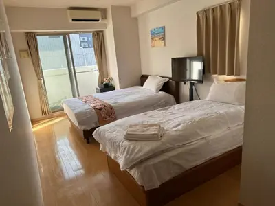 a hotel room with two beds and a window at ARSTAY Ikebukuro - Vacation STAY 65934v in Tokyo