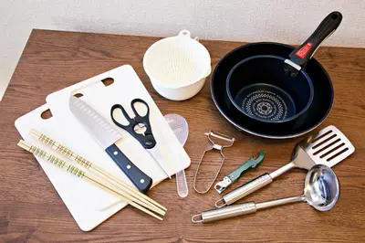 a table with utensils and a black bowl at Muse\u516b\u5e832F in Tokyo