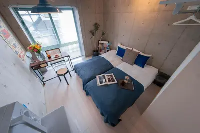 an overhead view of a bedroom with a bed and a table at Ueno Grand Maison Hotel in Tokyo