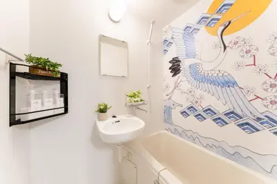 a bathroom with a sink and a bath tub at Japanese Art Room, 2Bed Room, 4Bed, Near Metro&JR station in Tokyo