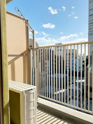 a balcony with a bench and a view of a city at Ikebukuro Center! Ikebukuro 6min walk! \u6c60\u888b\u4e2d\u5fc3\u5730\u5e26! \u6c60\u888b\u8f66\u7ad9\u6b65\u884c6\u5206! \u516c\u5bd3\u5e72\u6e7f\u5206\u79bb! \u667a\u80fd\u9a6c\u6876! \u9ad8\u901f\u65e0\u9650\u5236\u7f51\u8def!Autolock702 in Tokyo