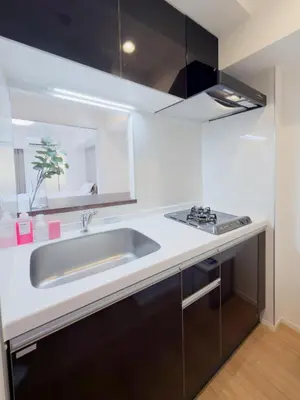 a kitchen with a sink and a stove at Asakusa 801 Triple Room in Tokyo