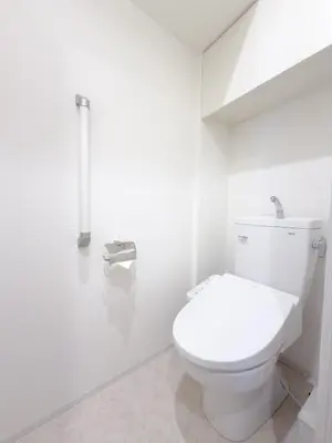 a white bathroom with a toilet in a room at Asakusa 802 Triple Room in Tokyo