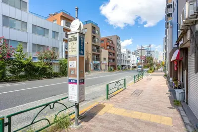 a street sign on the side of a road at Emilio Nishi Shinjuku in Tokyo