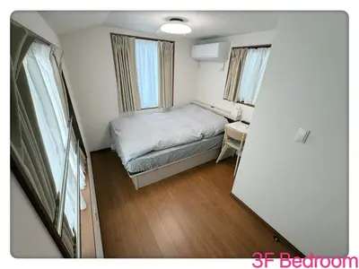 a small bedroom with a bed and a desk at Hao Bros Home Gemini B in Tokyo
