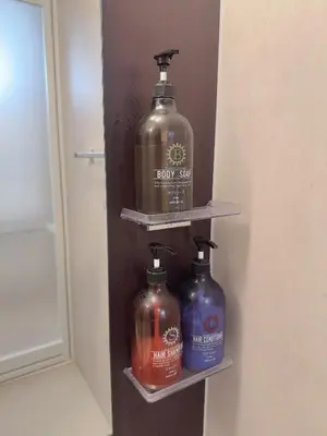 a shelf with two large bottles of laundry detergent at Tulip Asakusa in Tokyo