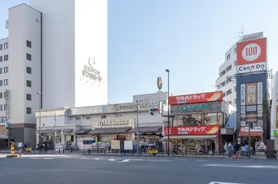 a busy city street with many shops and buildings at AlTERNA\u6075\u6bd4\u5bff in Tokyo