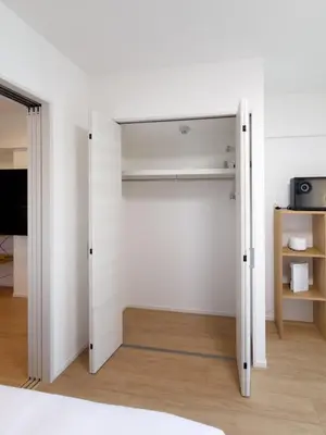 a closet with white walls and a door at Asakusa 701 Quad Room in Tokyo
