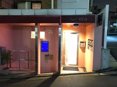 a door to a building with a sign on it at A Cosy Daikanyama Stay at the Anime Sanctuary in Tokyo